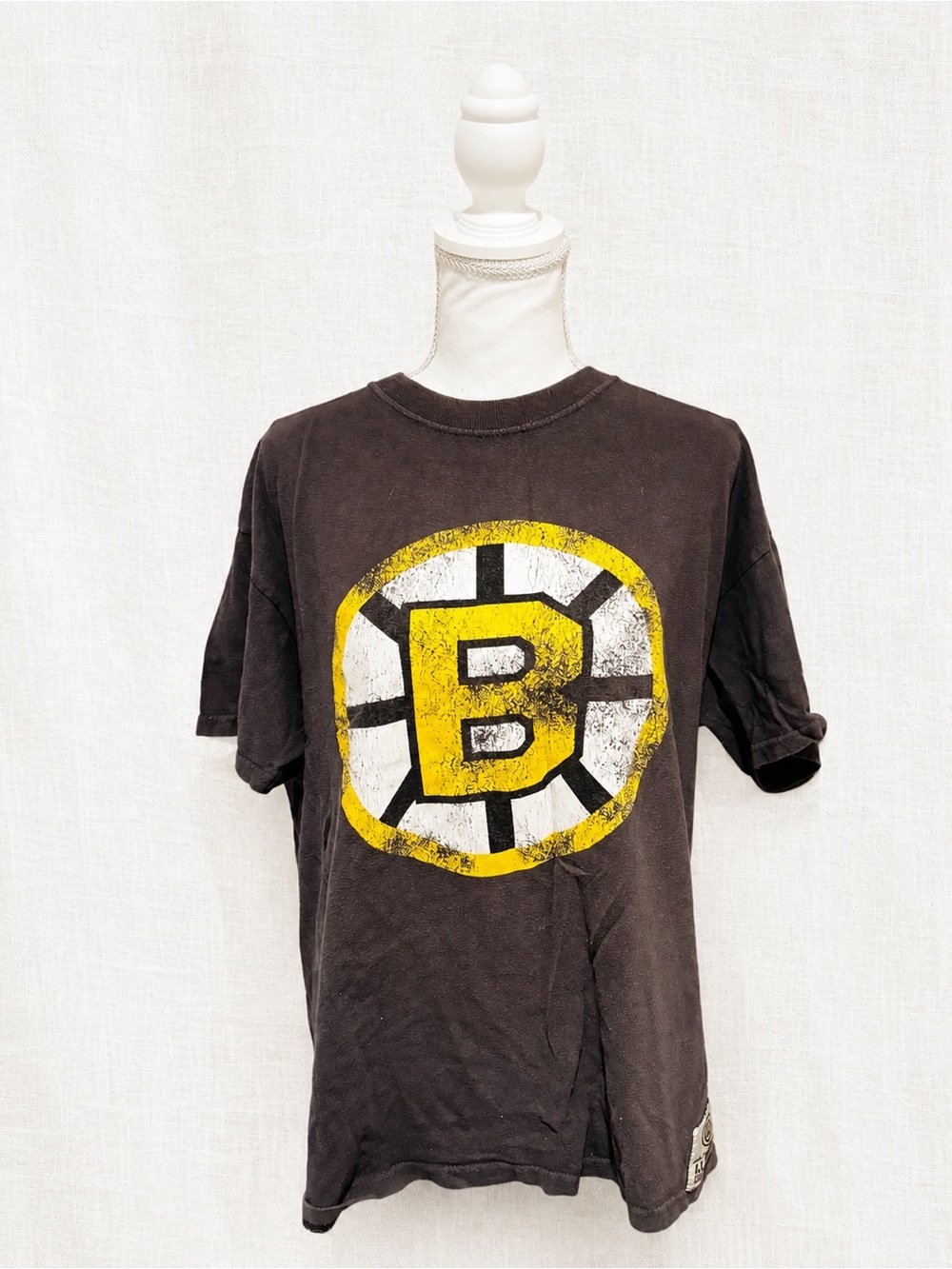 Vintage-Style Black Tee with Yellow 'B' Badge Graphic